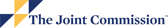 Logo for The Joint Commission, featuring a geometric shape in blue and gold.