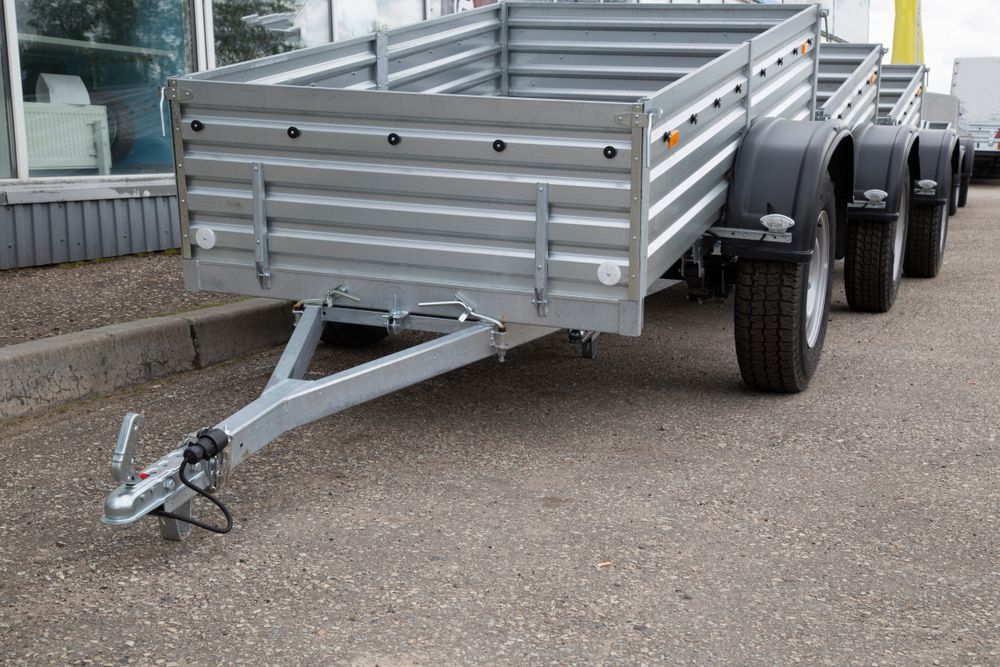 Silver Utility Trailers Parked On Asphalt — Soward Steel & Aluminium Fabrication in South Lismore, NSW