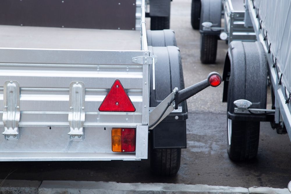 Back Of A Silver Utility Trailer With A Red Triangle And Lights — Soward Steel & Aluminium Fabrication in South Lismore, NSW