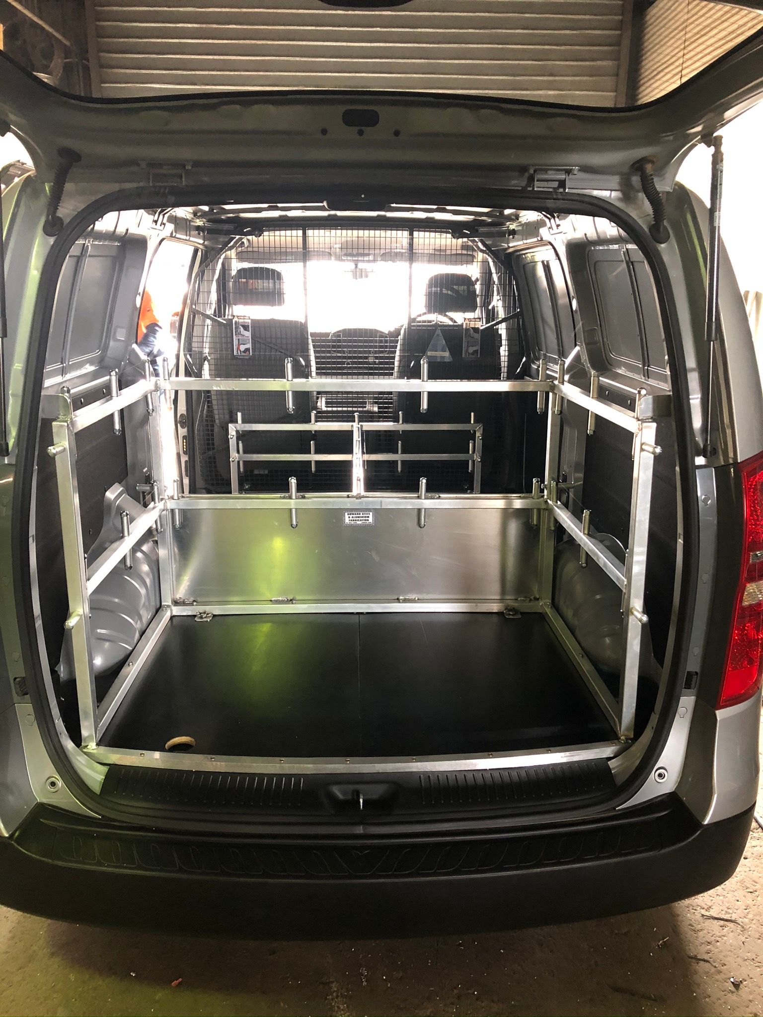 Rear View Of A Van Interior Modified With Metal Shelving — Soward Steel & Aluminium Fabrication in Byron Bay, NSW