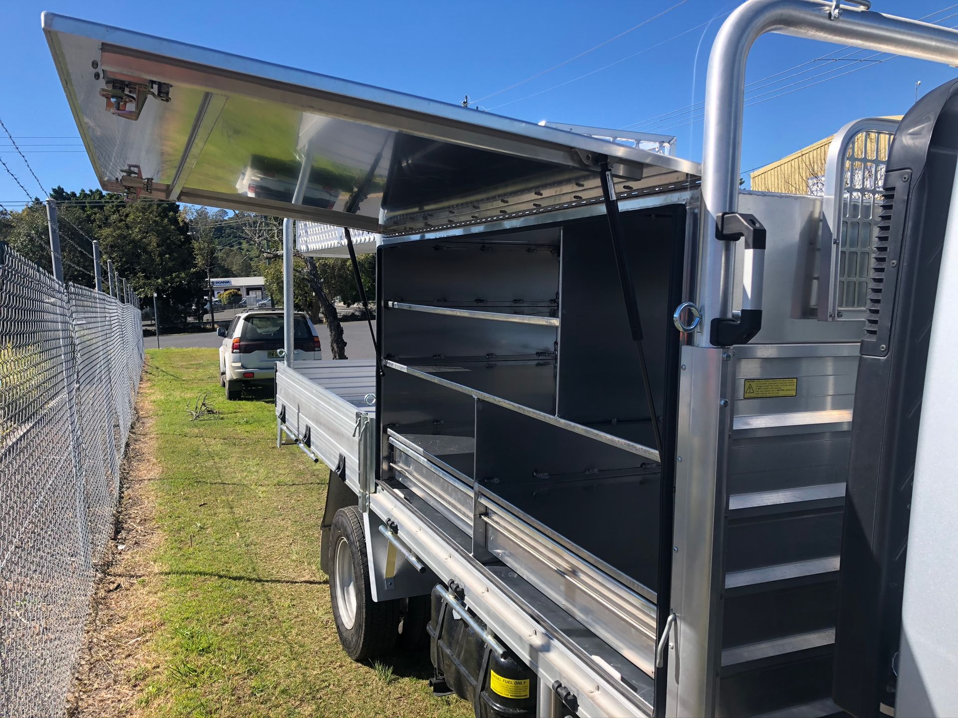 Open Side Of A Silver Truck Bed With Shelves — Soward Steel & Aluminium Fabrication in Kyogle, NSW