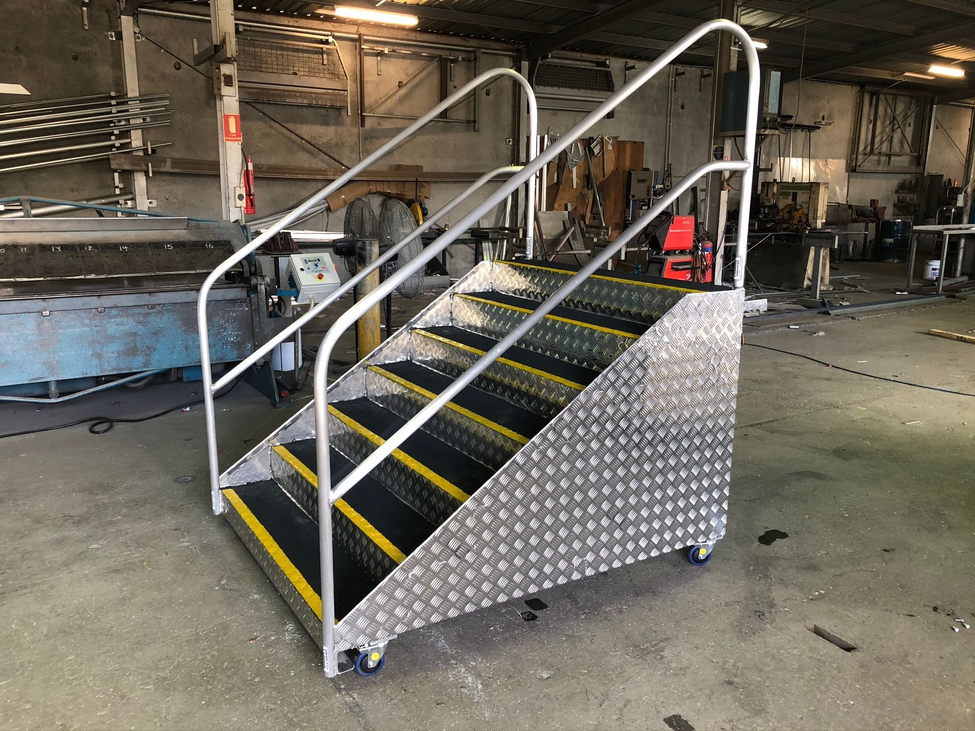 Mobile Aluminum Stair With Handrails And Diamond Plate Sides — Soward Steel & Aluminium Fabrication in Lismore, NSW