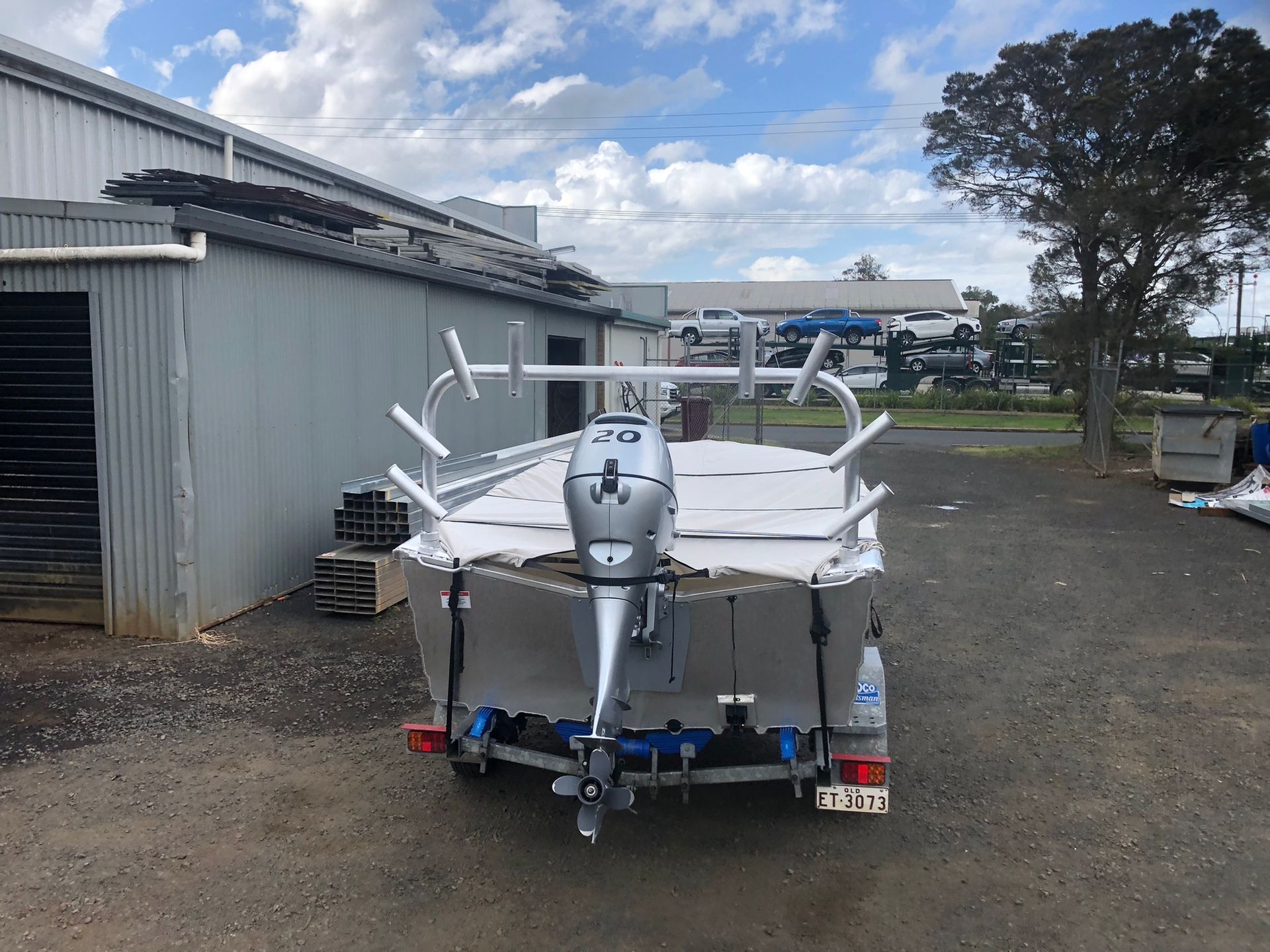 Aluminum Fishing Boat On A Trailer, Parked Outside A Warehouse — Soward Steel & Aluminium Fabrication in Kyogle, NSW