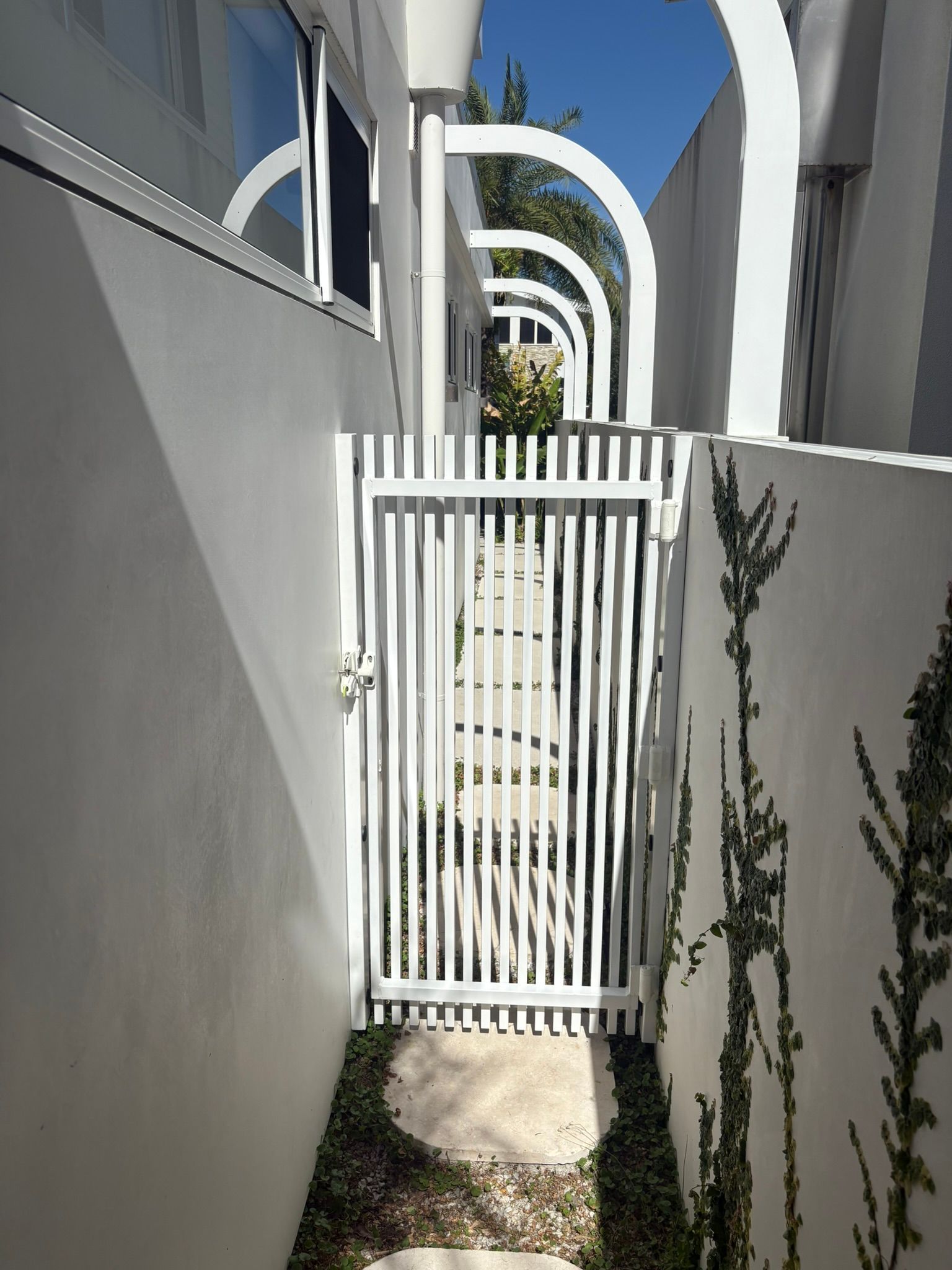 White Gate Leading To A Path With Archways — Soward Steel & Aluminium Fabrication in South Lismore, NSW