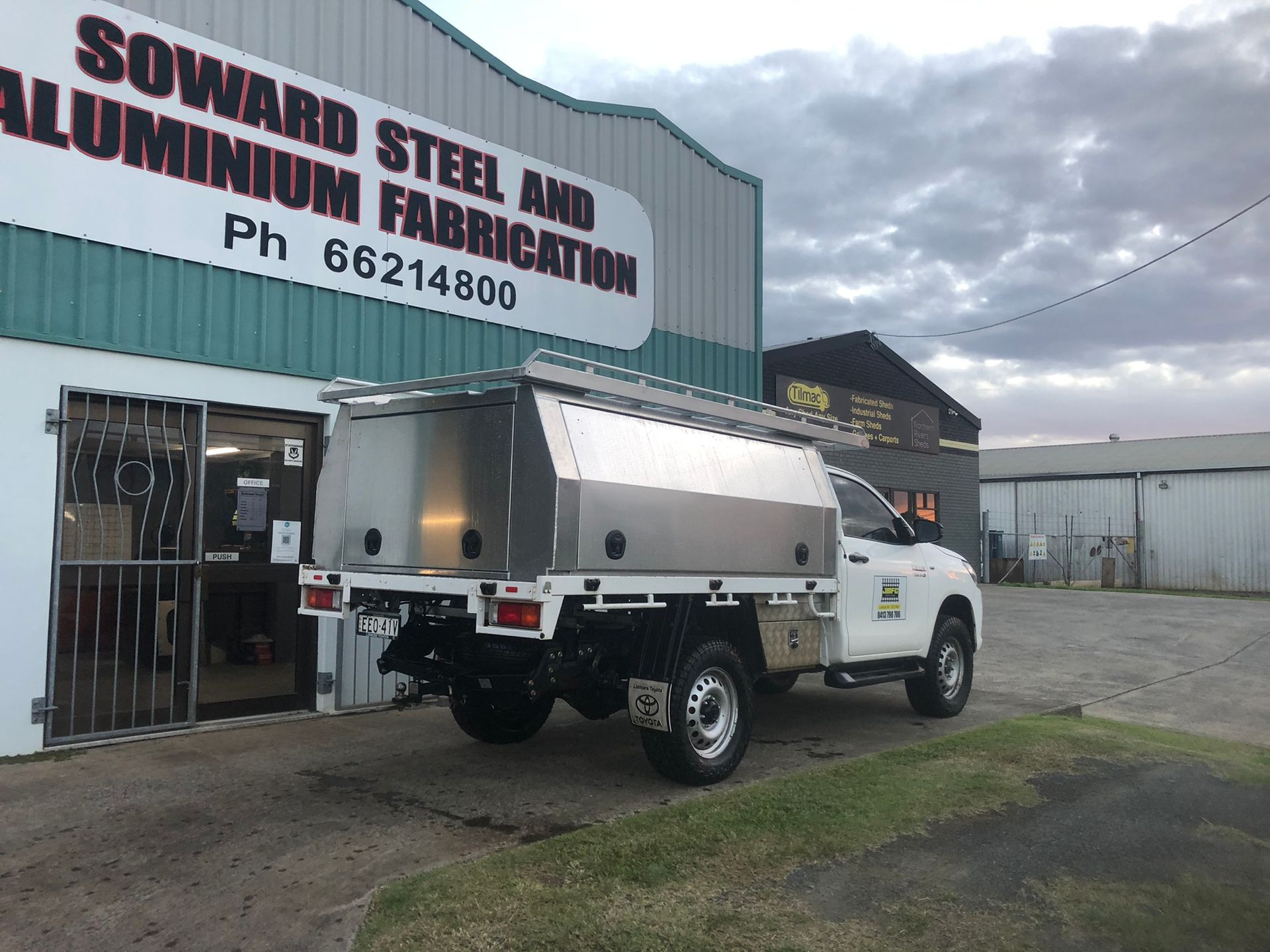 White Truck With A Silver Canopy Parked Outside A Building — Soward Steel & Aluminium Fabrication in Lismore, NSW