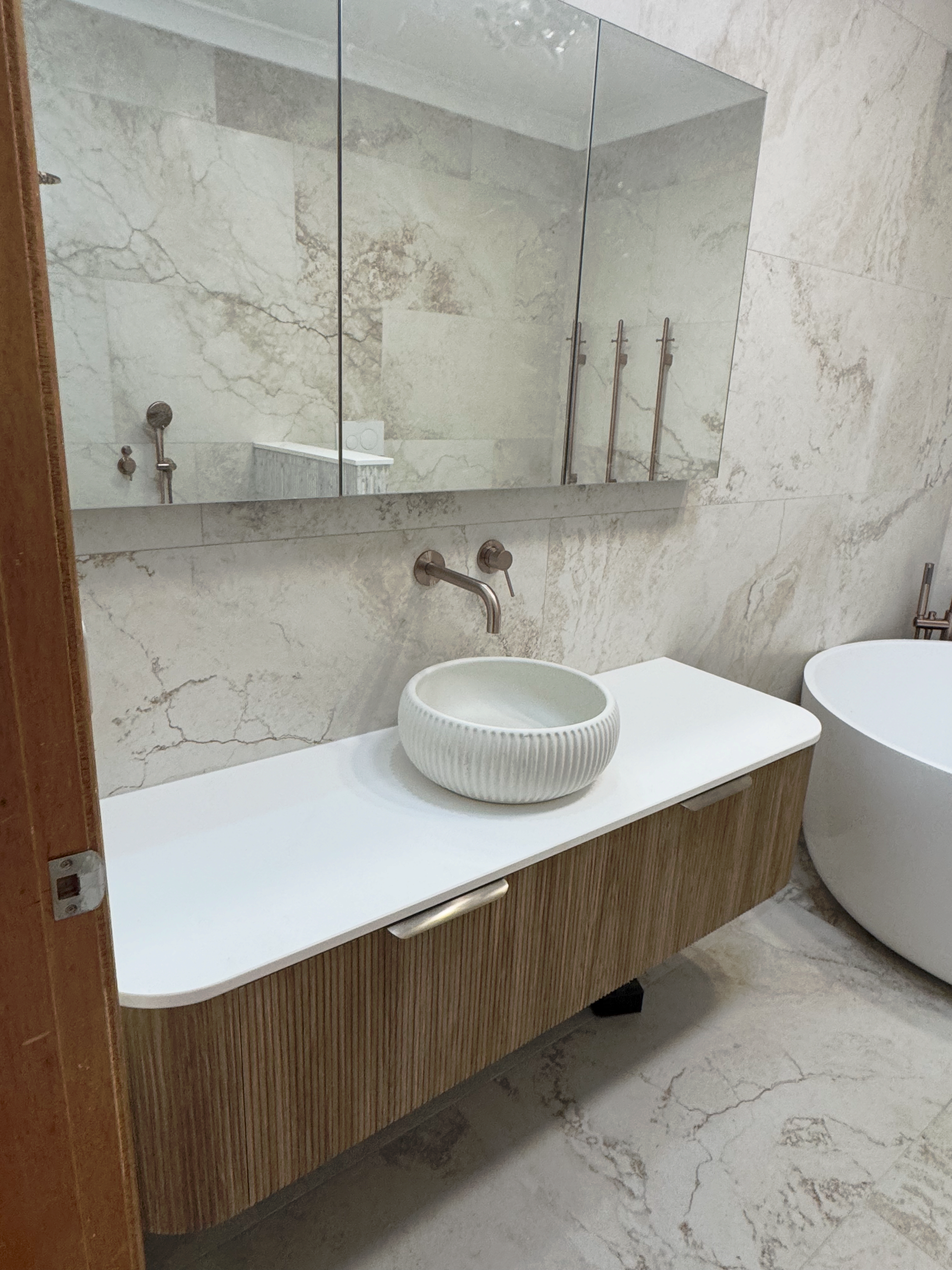 Bathroom with Bench and Sink and Bathtub— Fair Plumbing In Kembla Grange, NSW