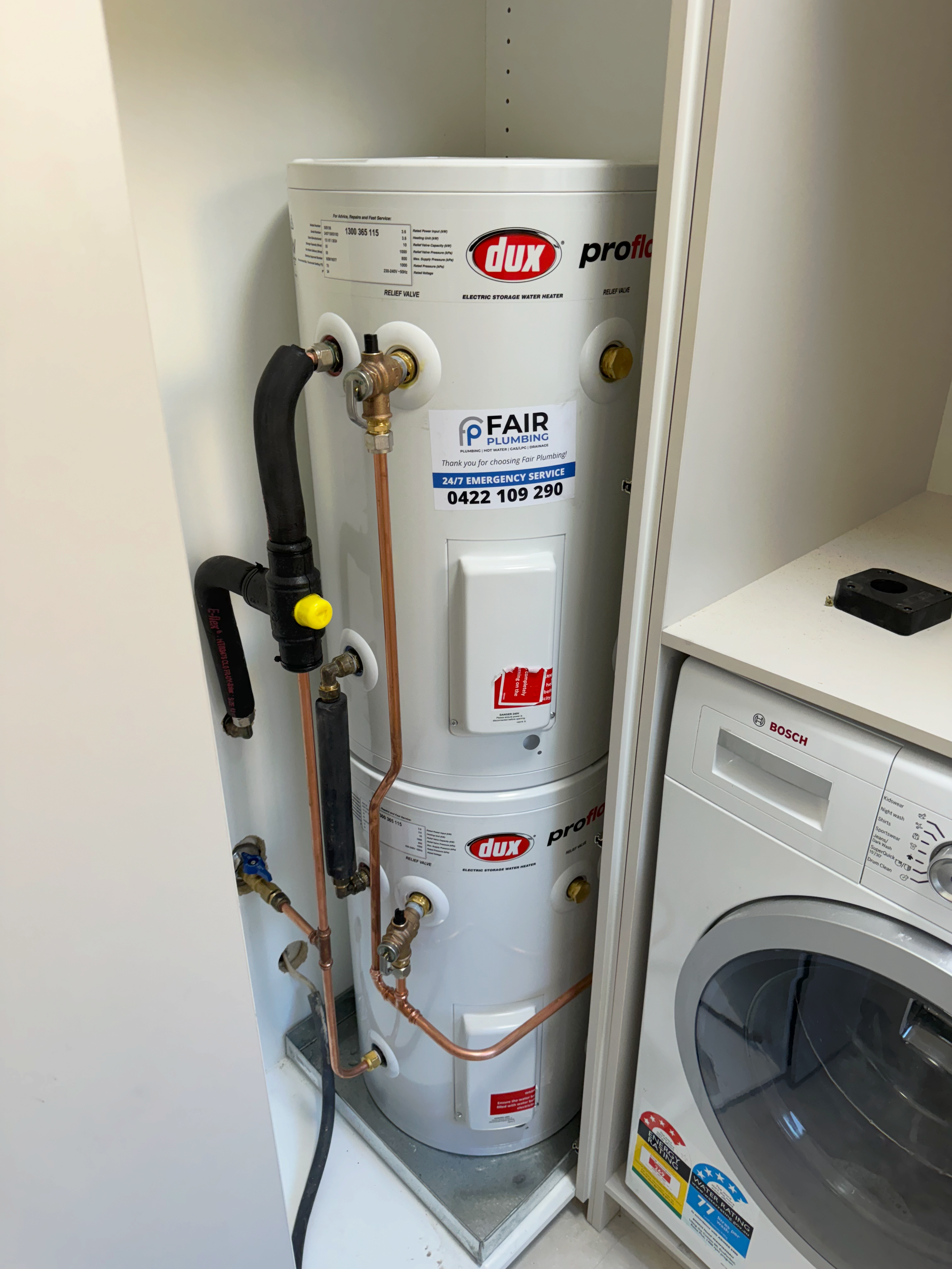 Two Hot Water Cylinders on top of each other — Fair Plumbing In Kembla Grange, NSW