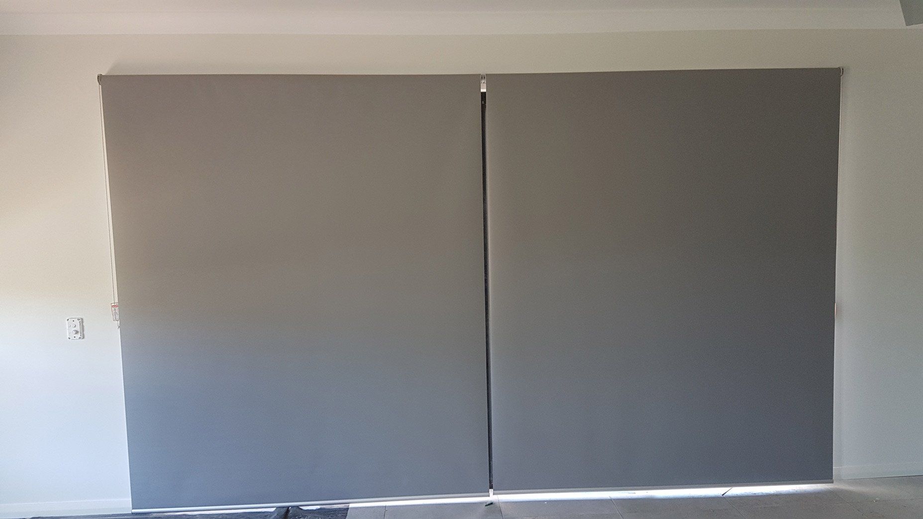 Gray Roller Blinds On Door — Blinds Installation in Winnellie, NT