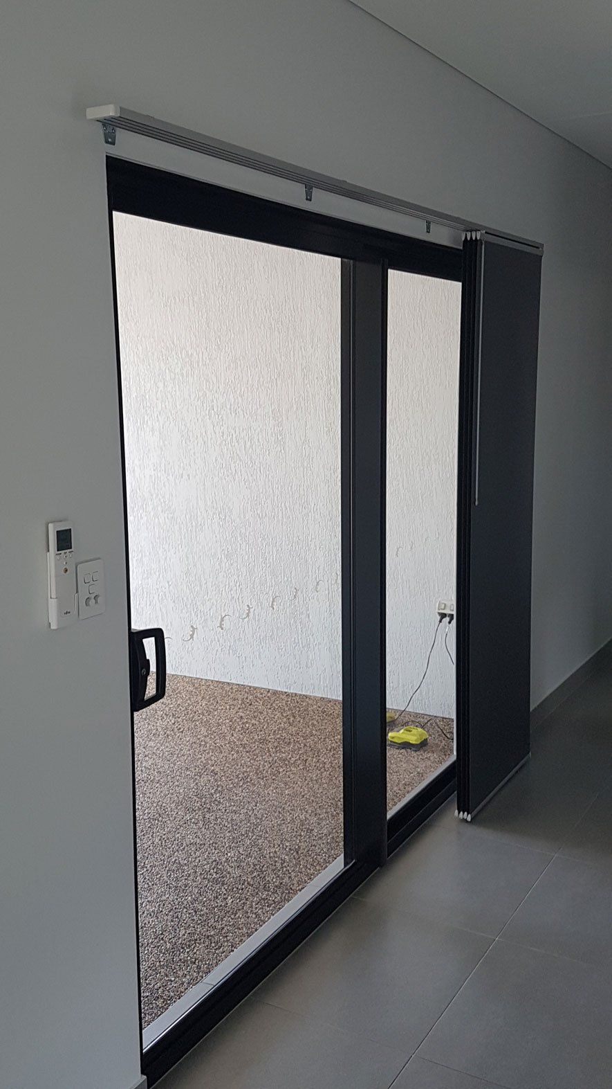Closed Sliding Door With Panel Blinds — Blinds Installation in Winnellie, NT