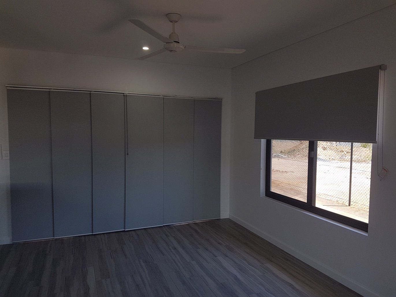 Door With Closed Panel Blinds — Blinds Installation in Winnellie, NT