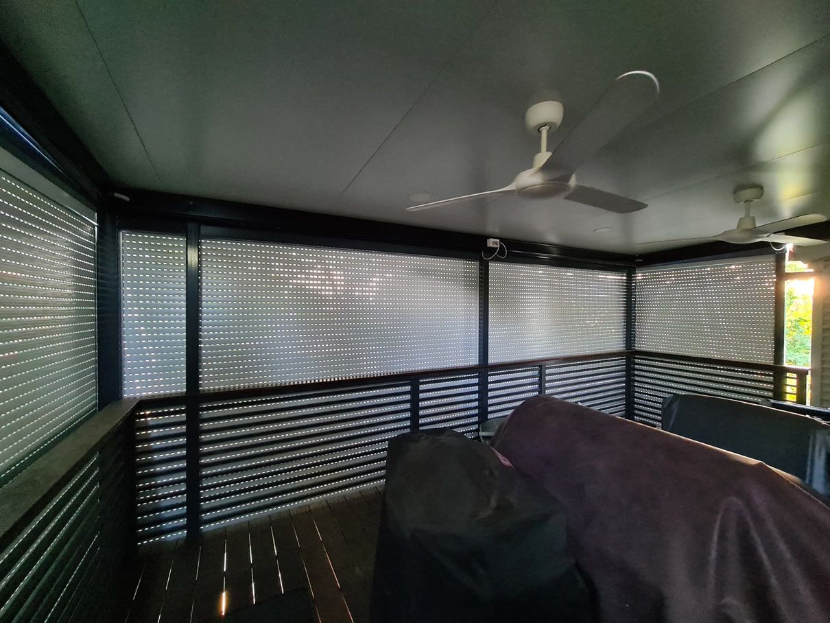 Roller shutters on balcony — Blinds Installation in Winnellie, NT