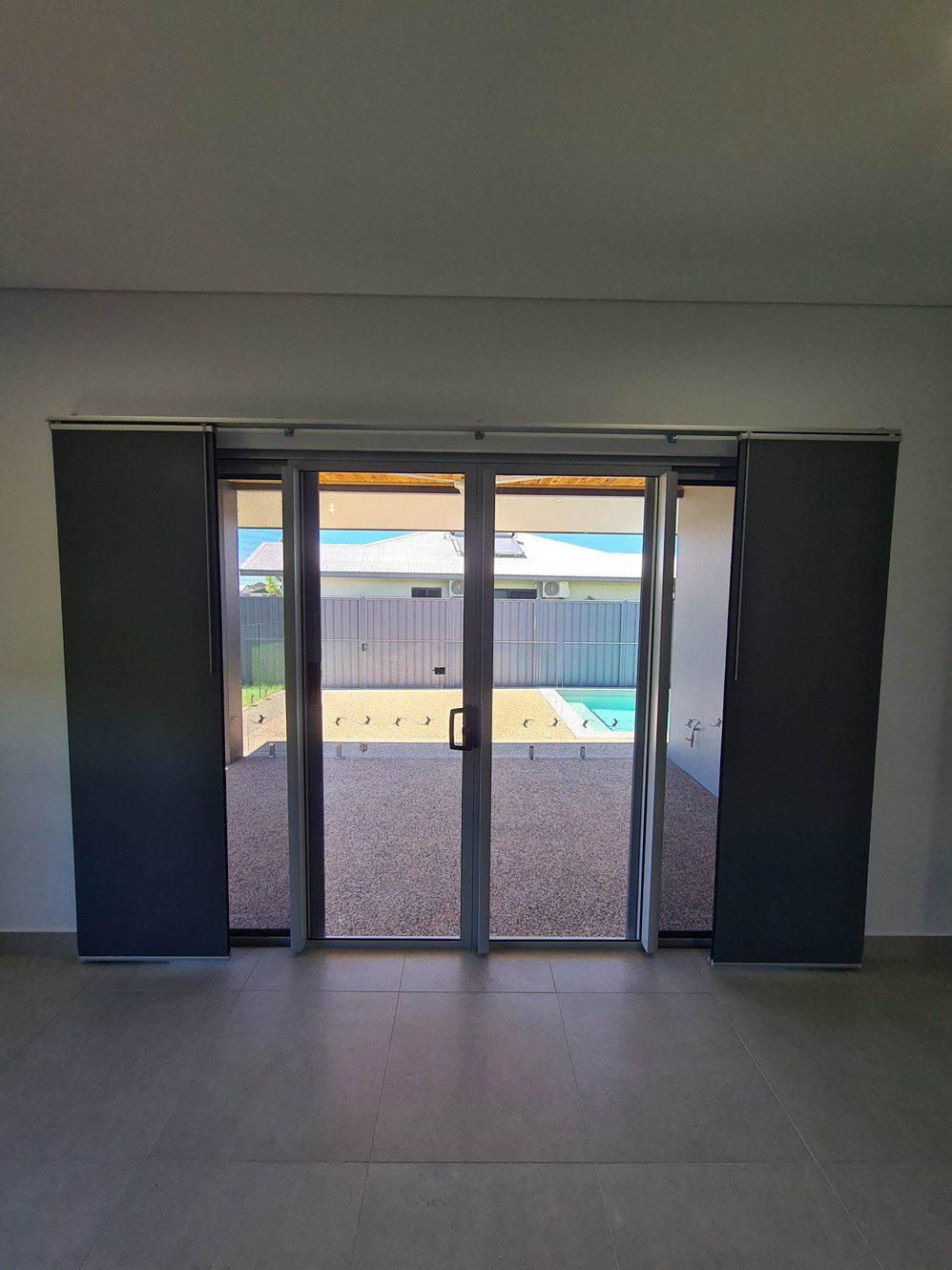Sliding Door With Panel Blinds — Blinds Installation in Winnellie, NT