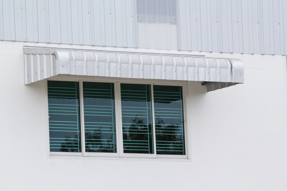 Silver Metal Awning Over Window — Blinds Installation in Katherine, NT