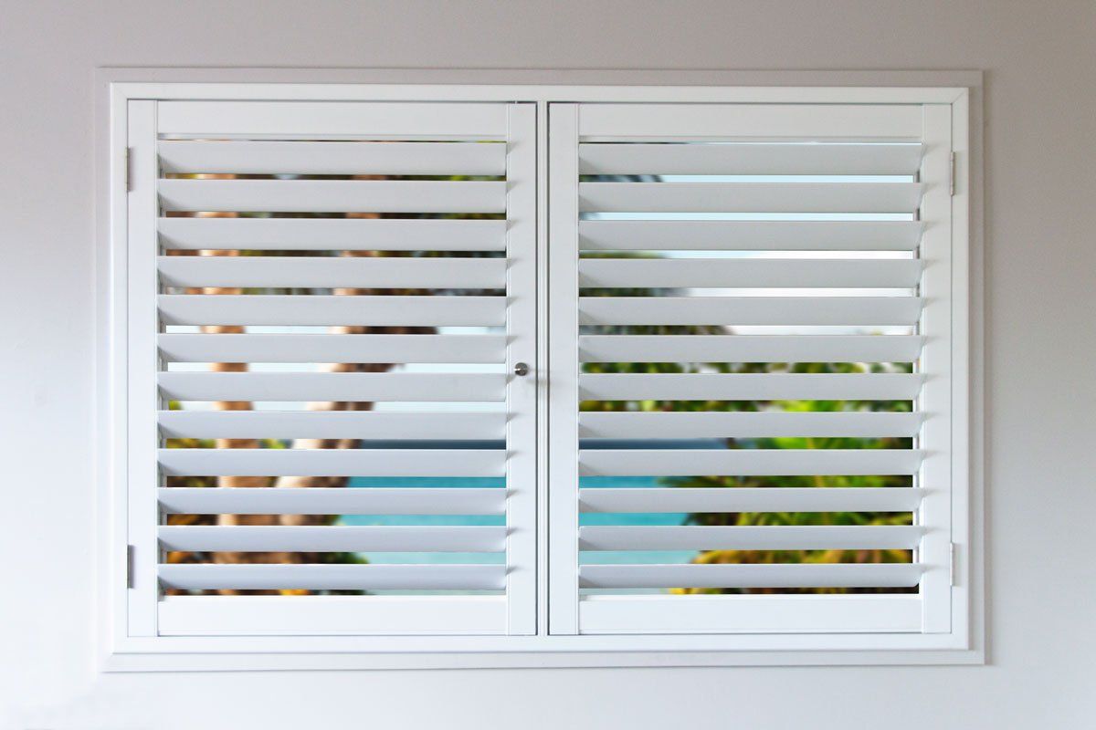 Half Closed Plantation Shutters With Ocean View — Blinds Installation in Winnellie, NT