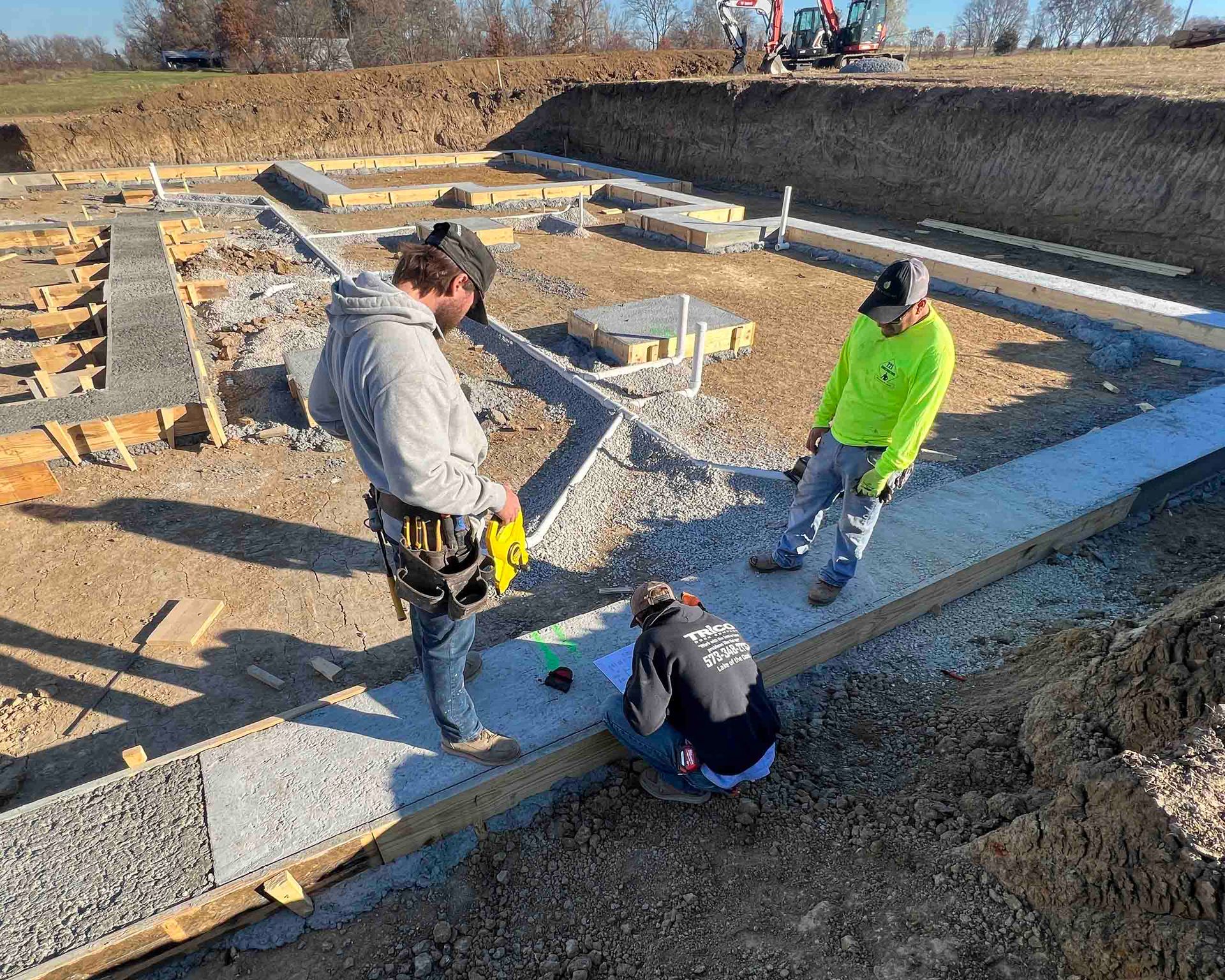 A group of construction workers are working on a construction site.