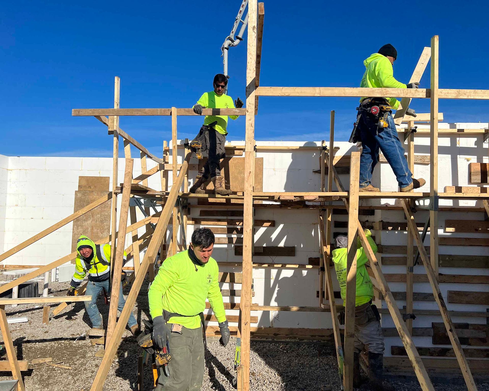 A group of construction workers are working on a building