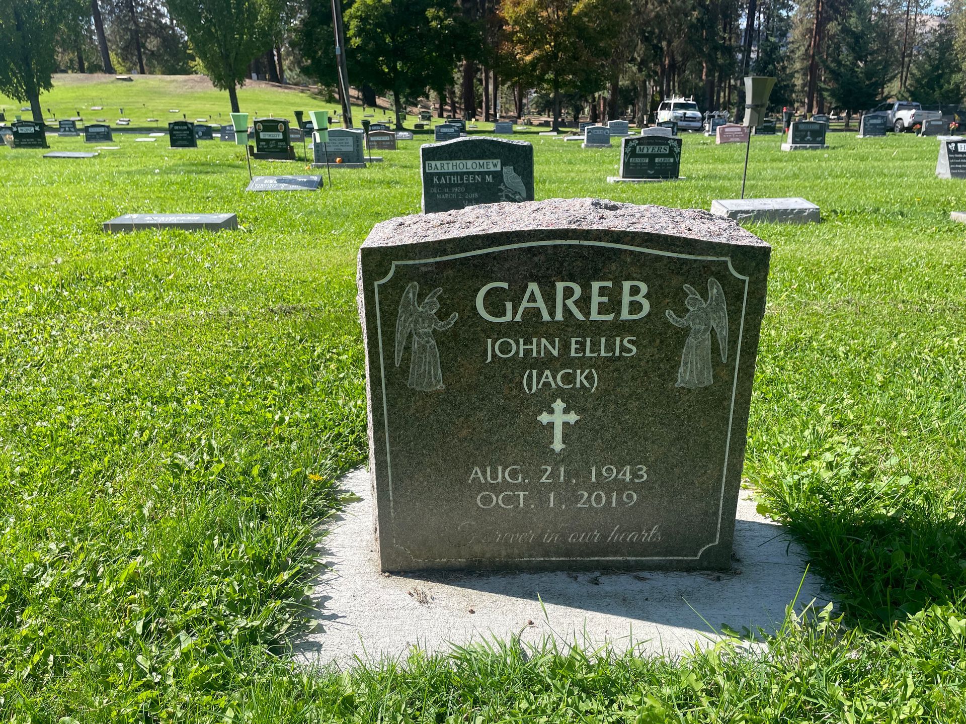 A gravestone in a cemetery for gareb john ellis