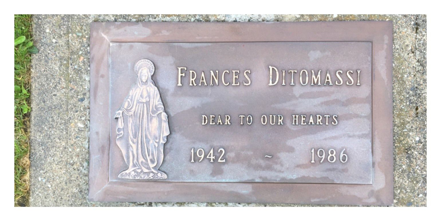 A gravestone for frances delomass dated 1942 and 1986