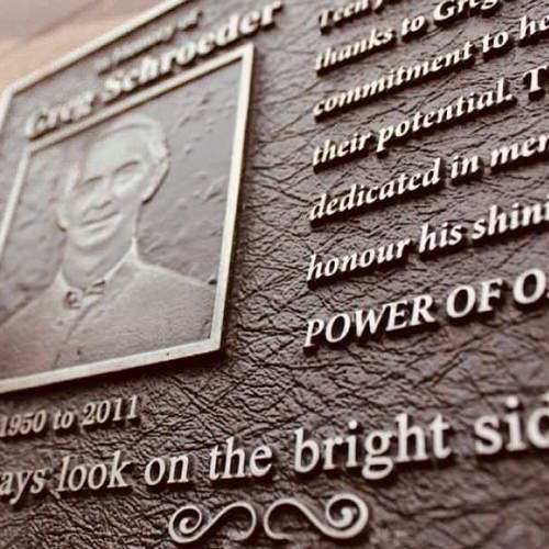 A plaque with a picture of a man on it