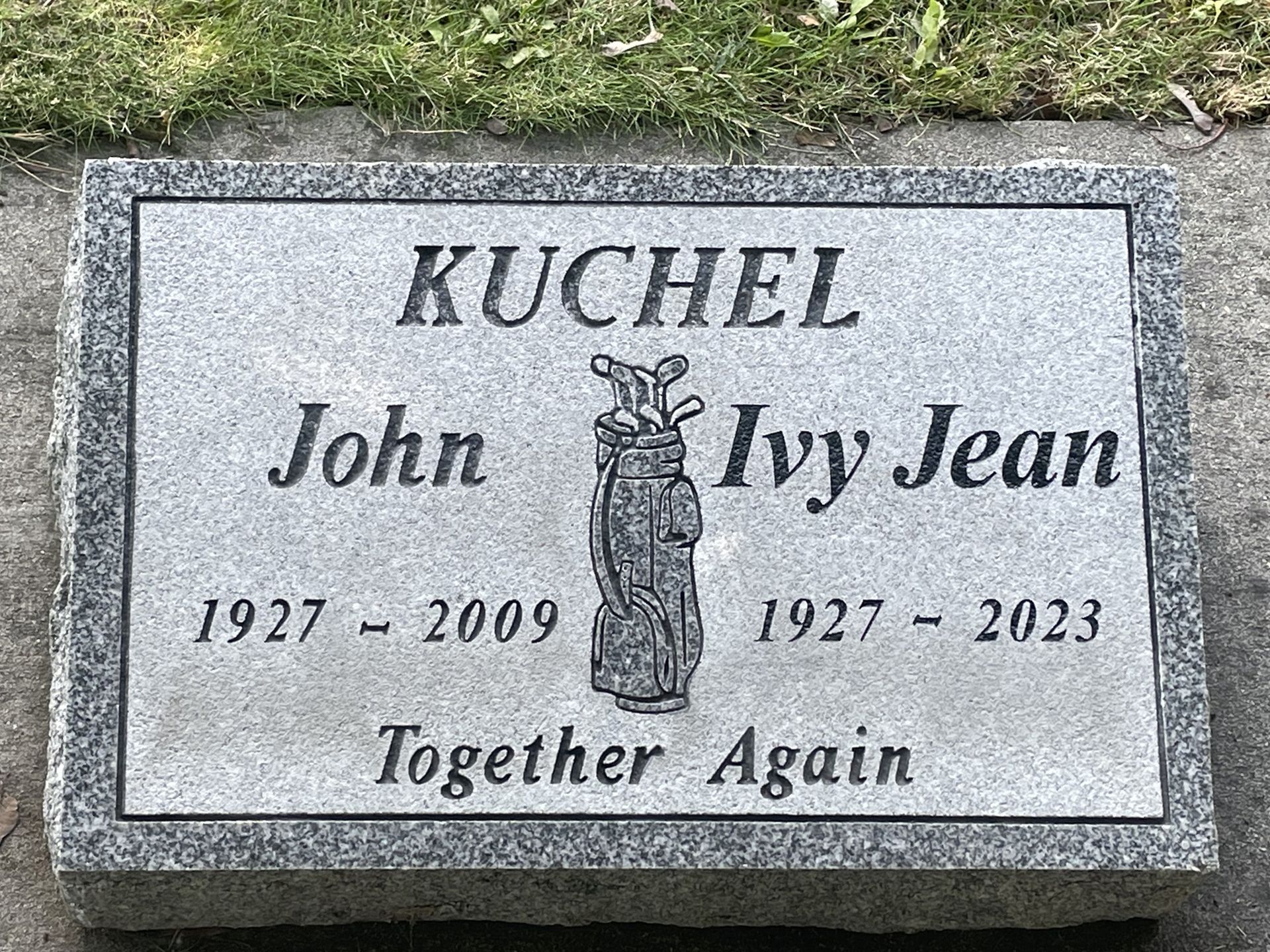 A gravestone for john and ivy jean with a golf bag on it.