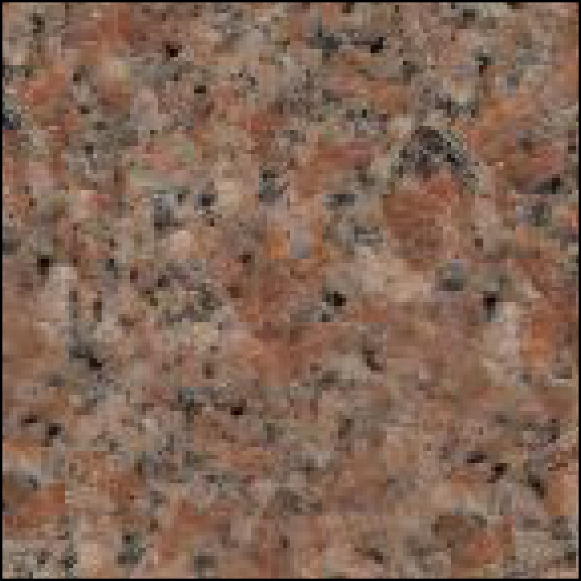 A close up of a pink granite counter top.