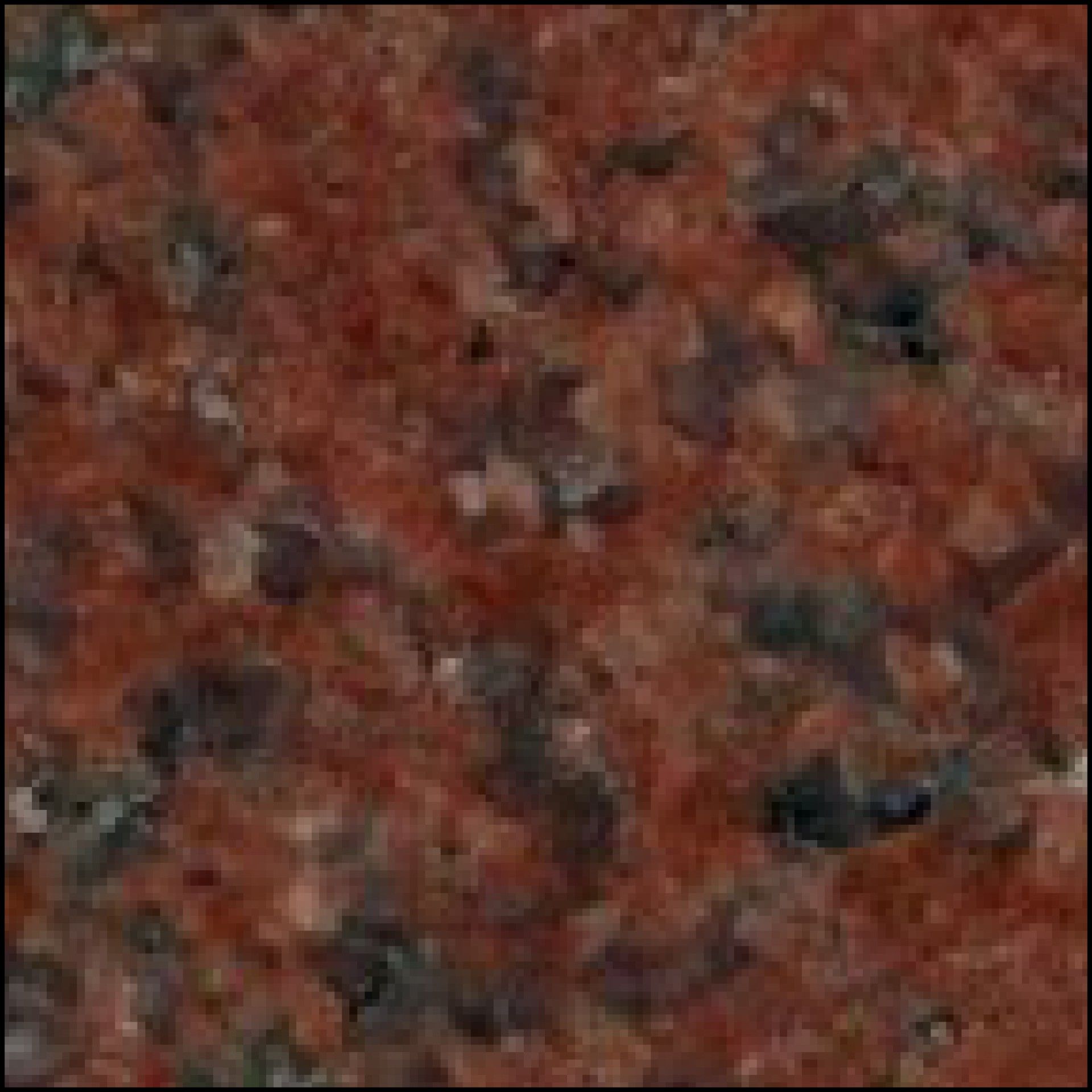A close up of a red granite counter top.