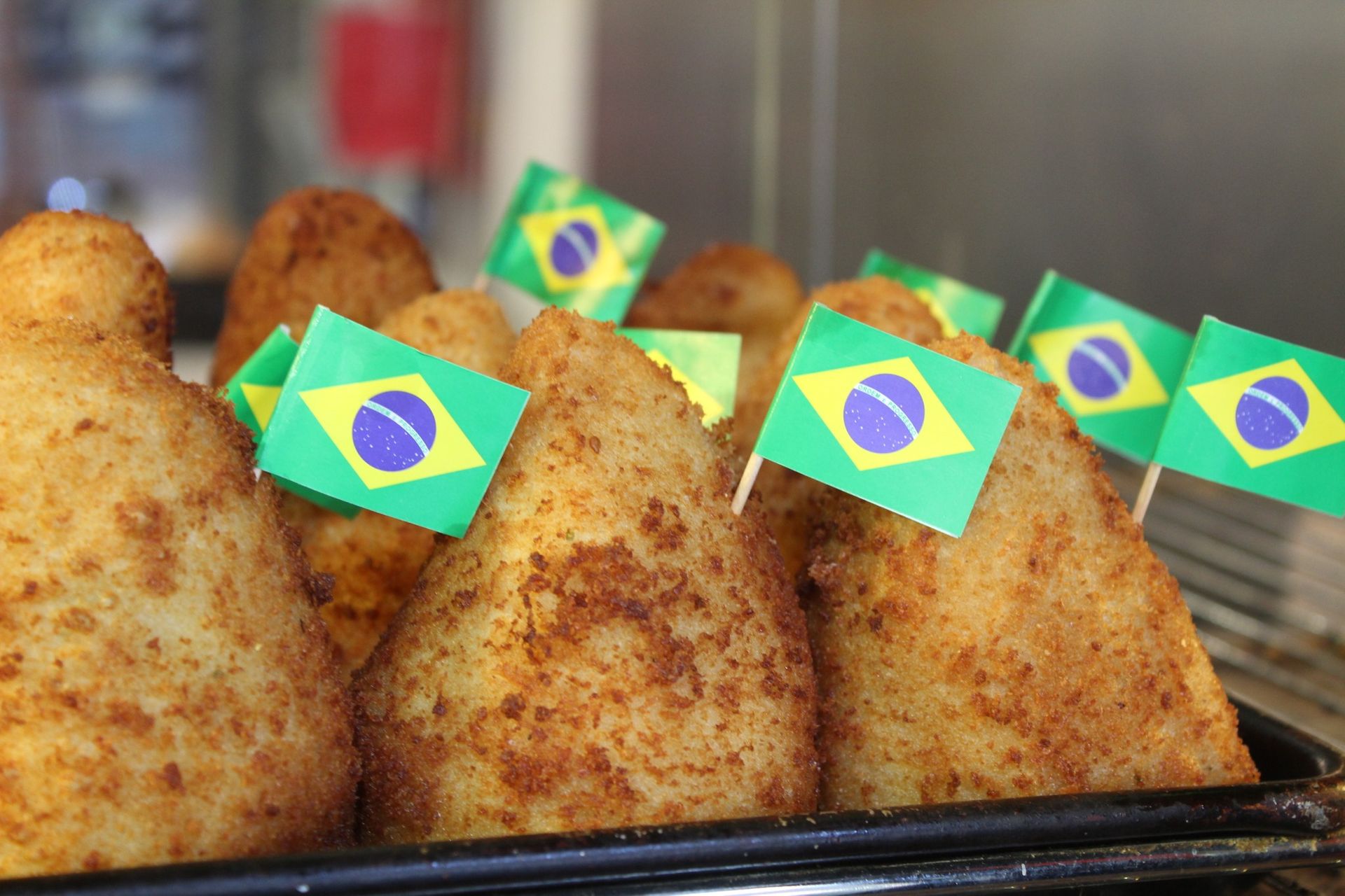 A bunch of fried food with flags on them