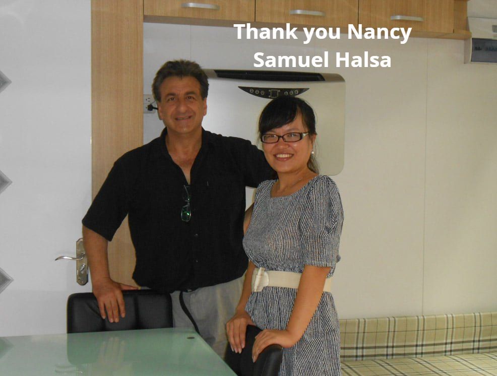 Man and woman standing indoors, smiling. Text overlay reads, 