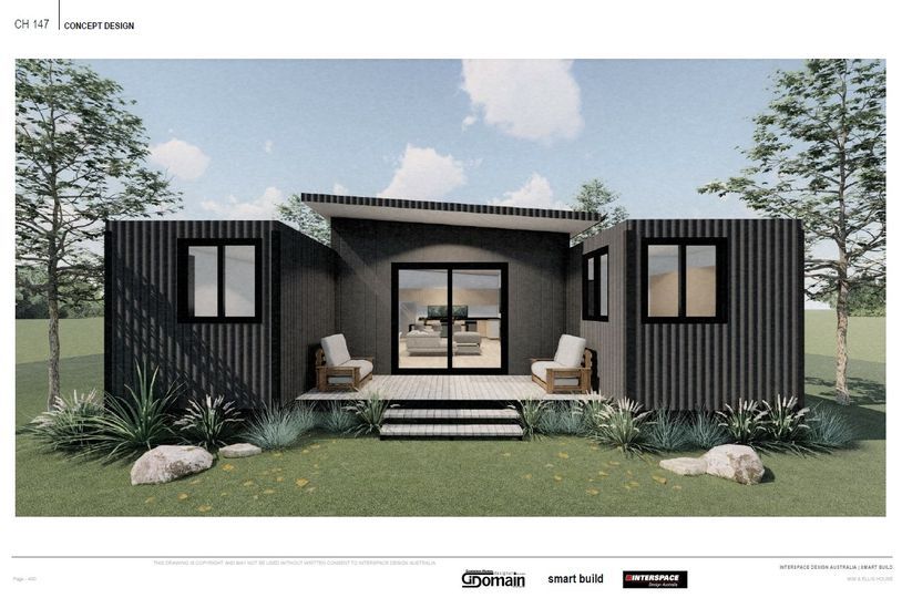 Modern home design with shipping containers, featuring dark siding, a deck, and surrounding landscaping.