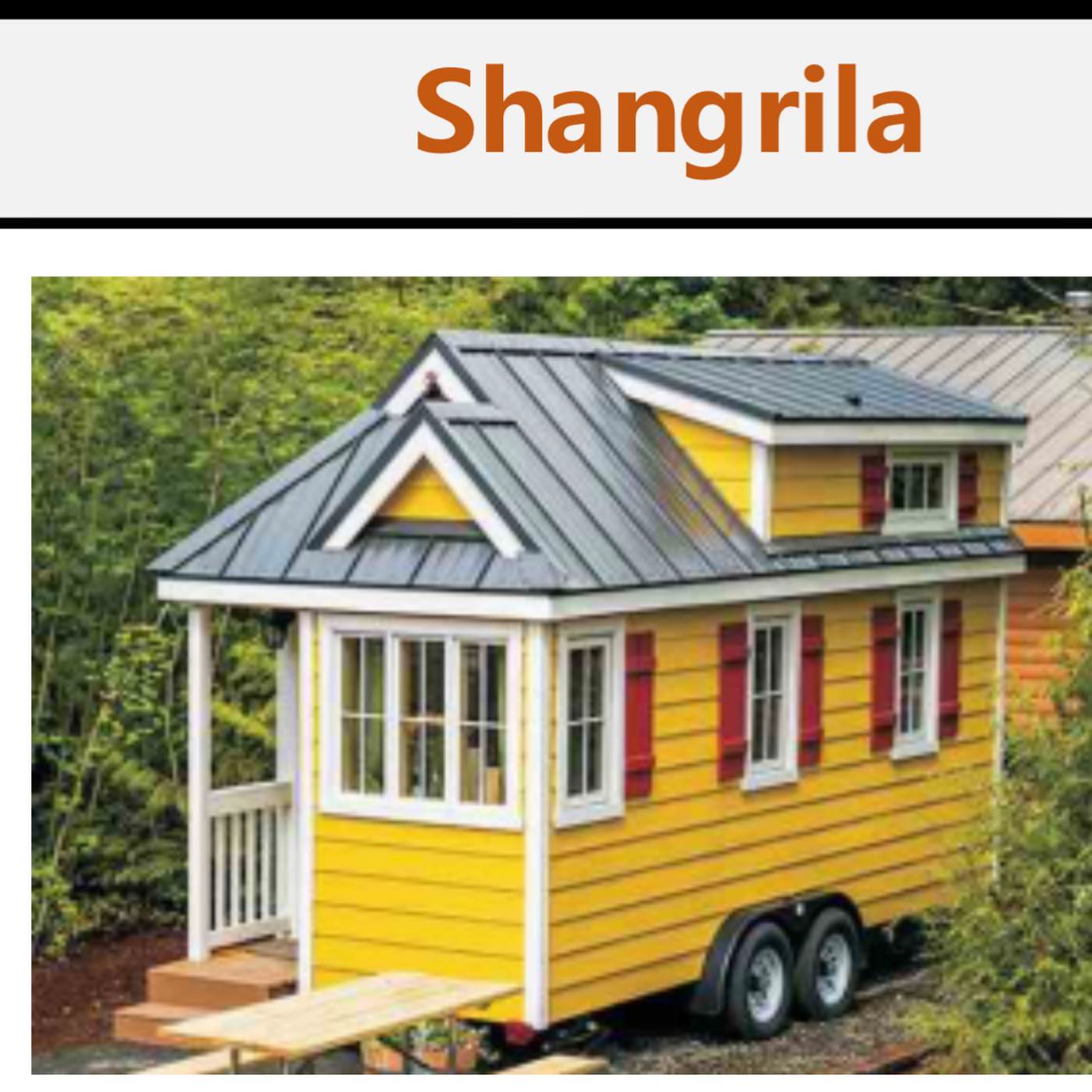 Yellow tiny house on wheels with red shutters, a metal roof, and a porch.