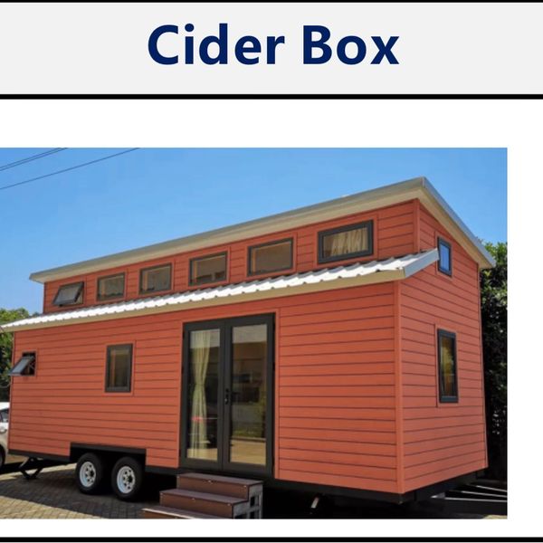 A tiny orange house on wheels, titled 