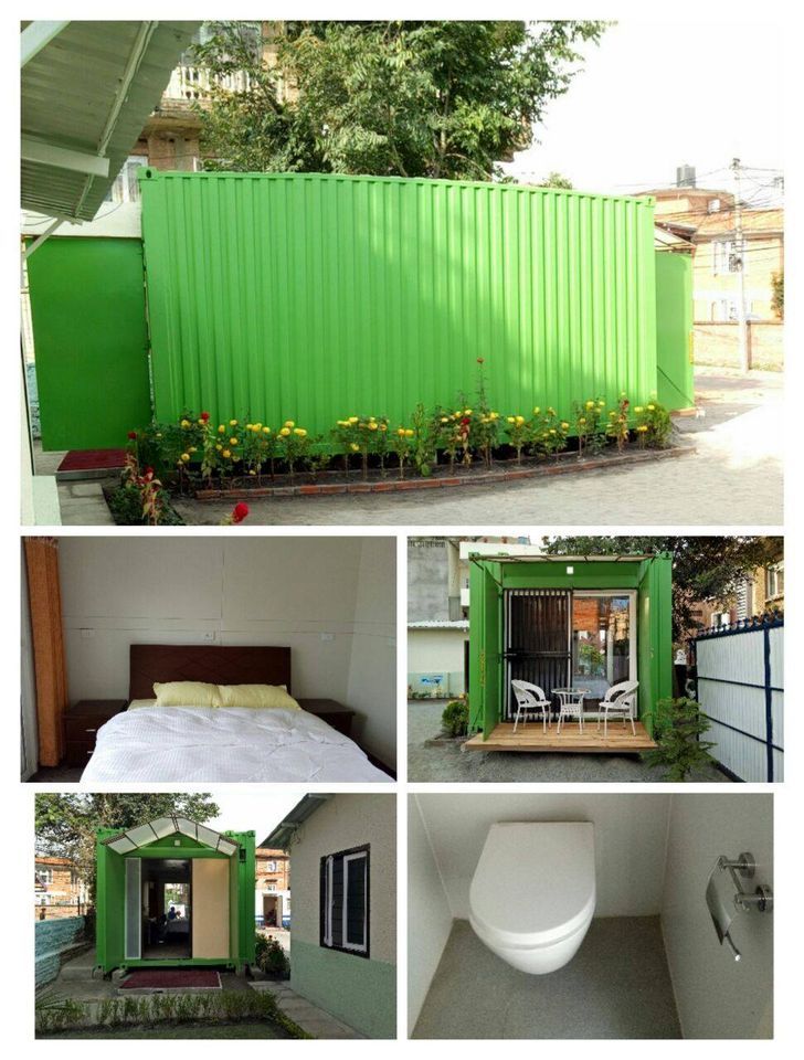 Green shipping container converted into a living space, featuring a bedroom, patio, and bathroom.