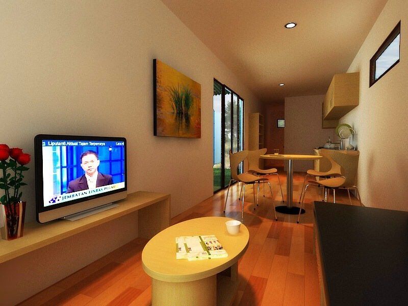 Living room with TV, coffee table, dining table, and artwork. Wooden floors and natural light.