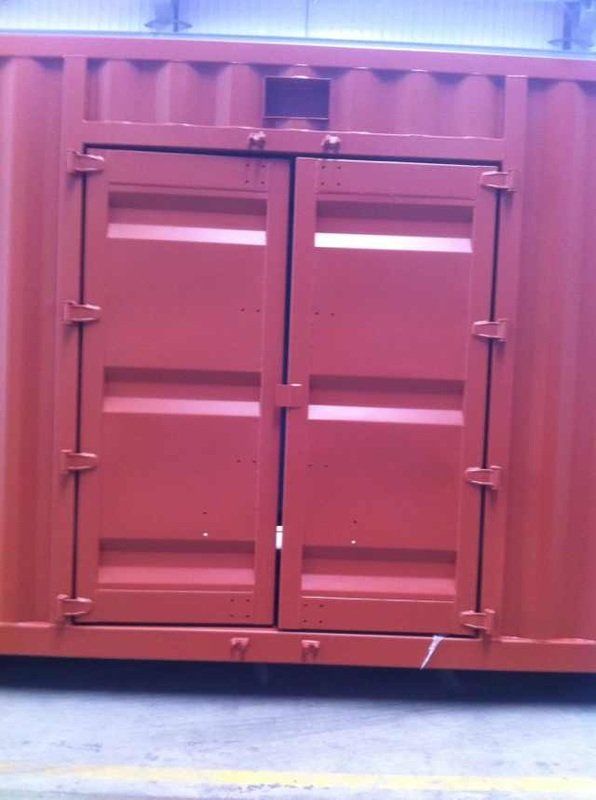 Red shipping container with closed double doors.