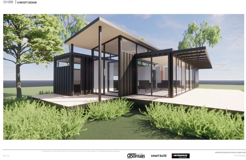 Modern cabin with glass walls and dark exterior, surrounded by green grass and trees.