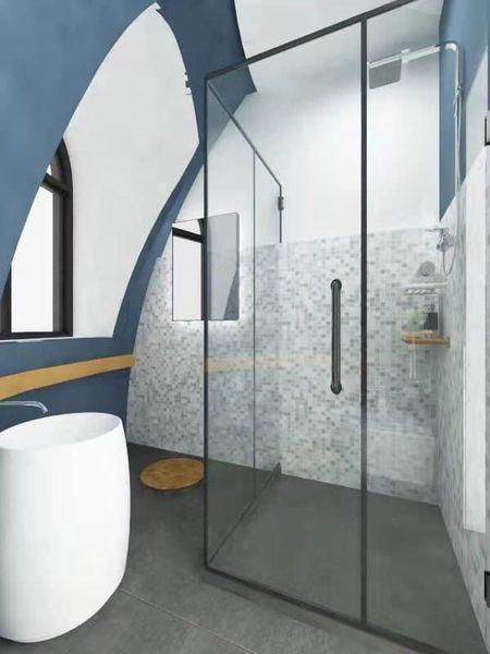 Bathroom with a white tub, glass shower, blue and white arched walls, and gray floor.