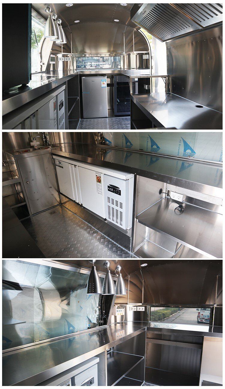 Stainless steel interior of a food truck. Countertops, refrigeration units, and exhaust hood are visible.