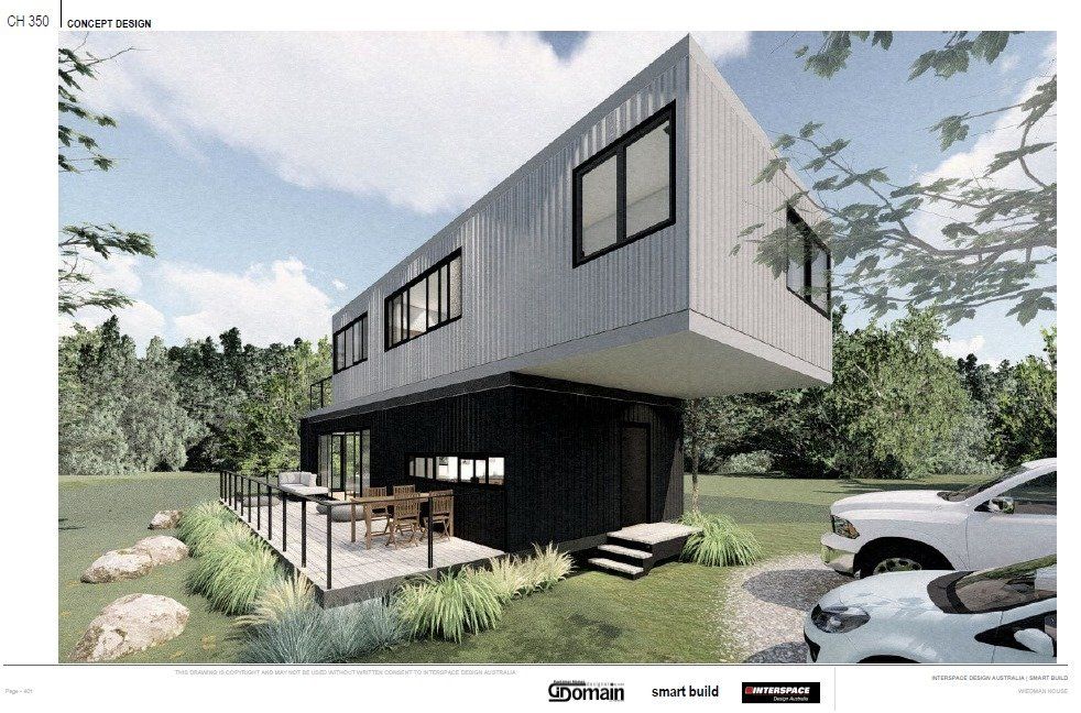 Modern two-story house, black and silver, with a cantilevered upper floor. Patio with outdoor furniture, cars parked.