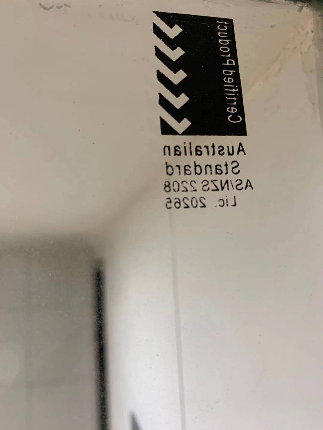 Black and white logo and text on a white surface, including 