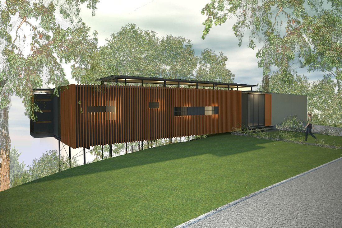 Modern home with wood slat facade and elevated structure on a grassy hillside.