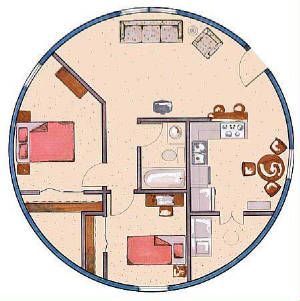 Floor plan of a round house with two bedrooms, bathroom, kitchen, and living area; light beige walls.