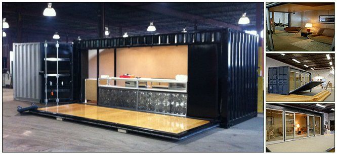 Black shipping container converted into a store with an open display area and a wooden floor.