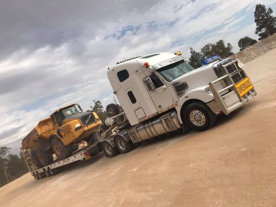 Two Yellow Tractors Are Parked Next to Each Other on A Sunny Day — Albury Demolitions in Bright, NSW