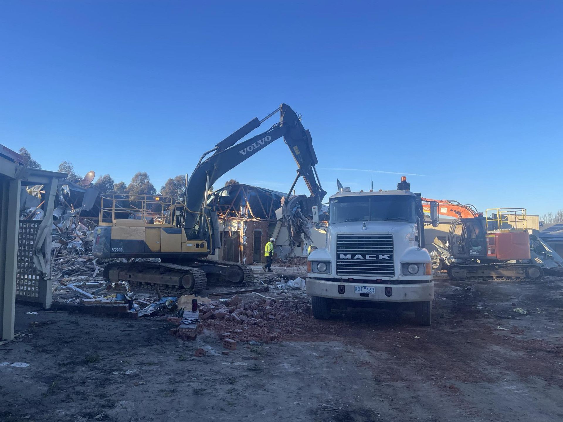 A Large Building Is Being Demolished by A Bulldozer — Albury Demolitions in Bright, NSW