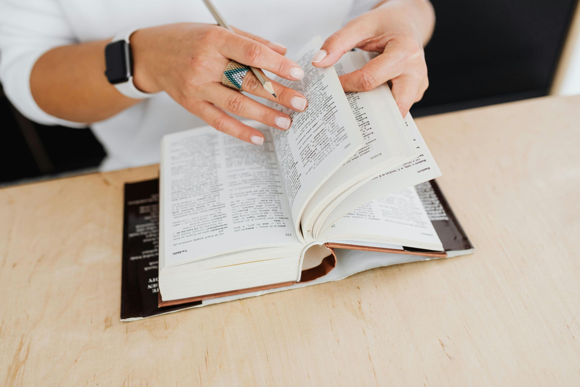 person taking notes in a notebok