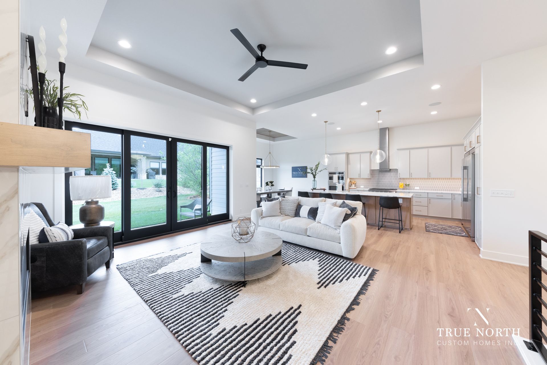 Living Room / Kitchen Luxury Townhome By True North Custom Homes.