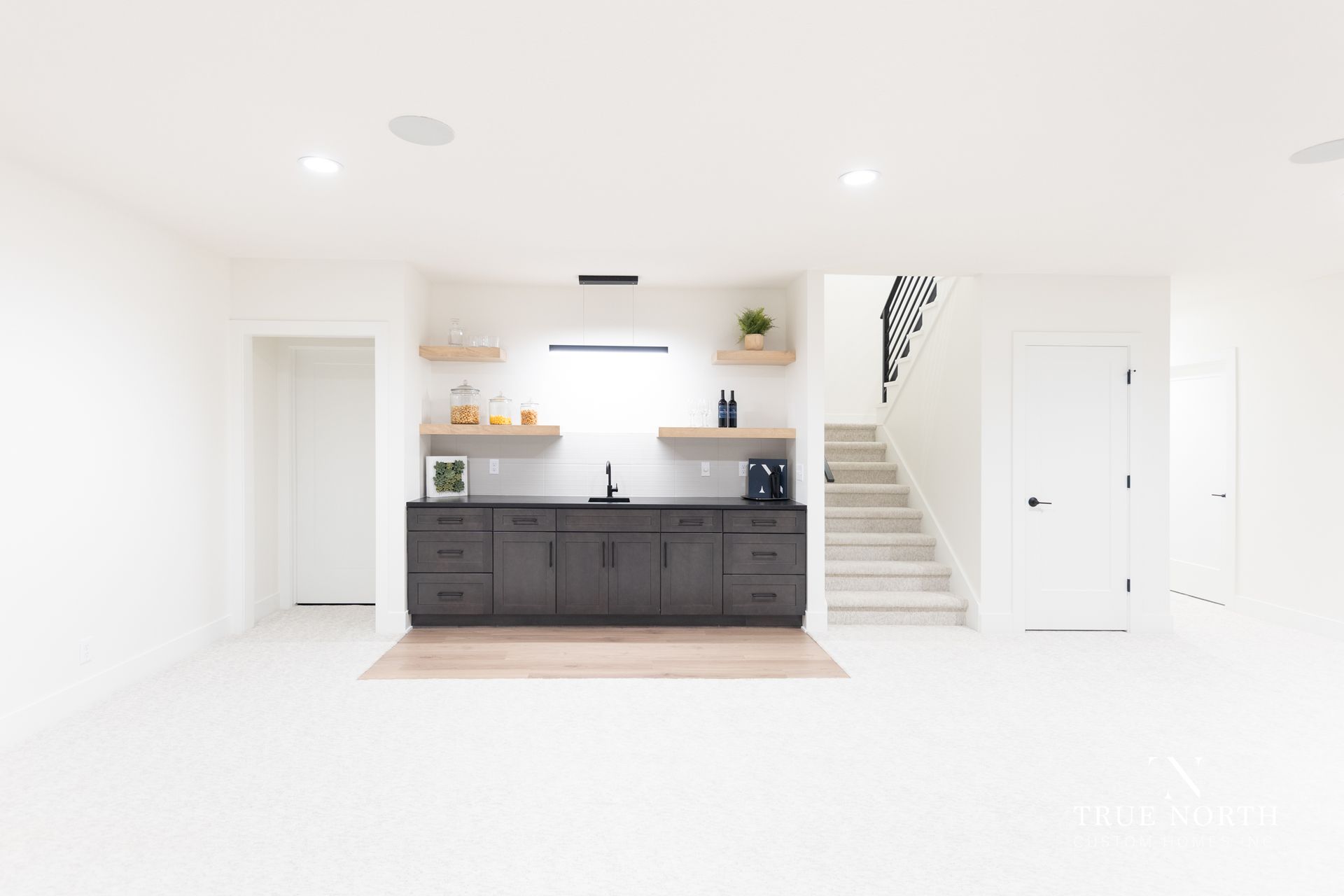 Basement / Wet Ba Luxury Townhome By True North Custom Homes.