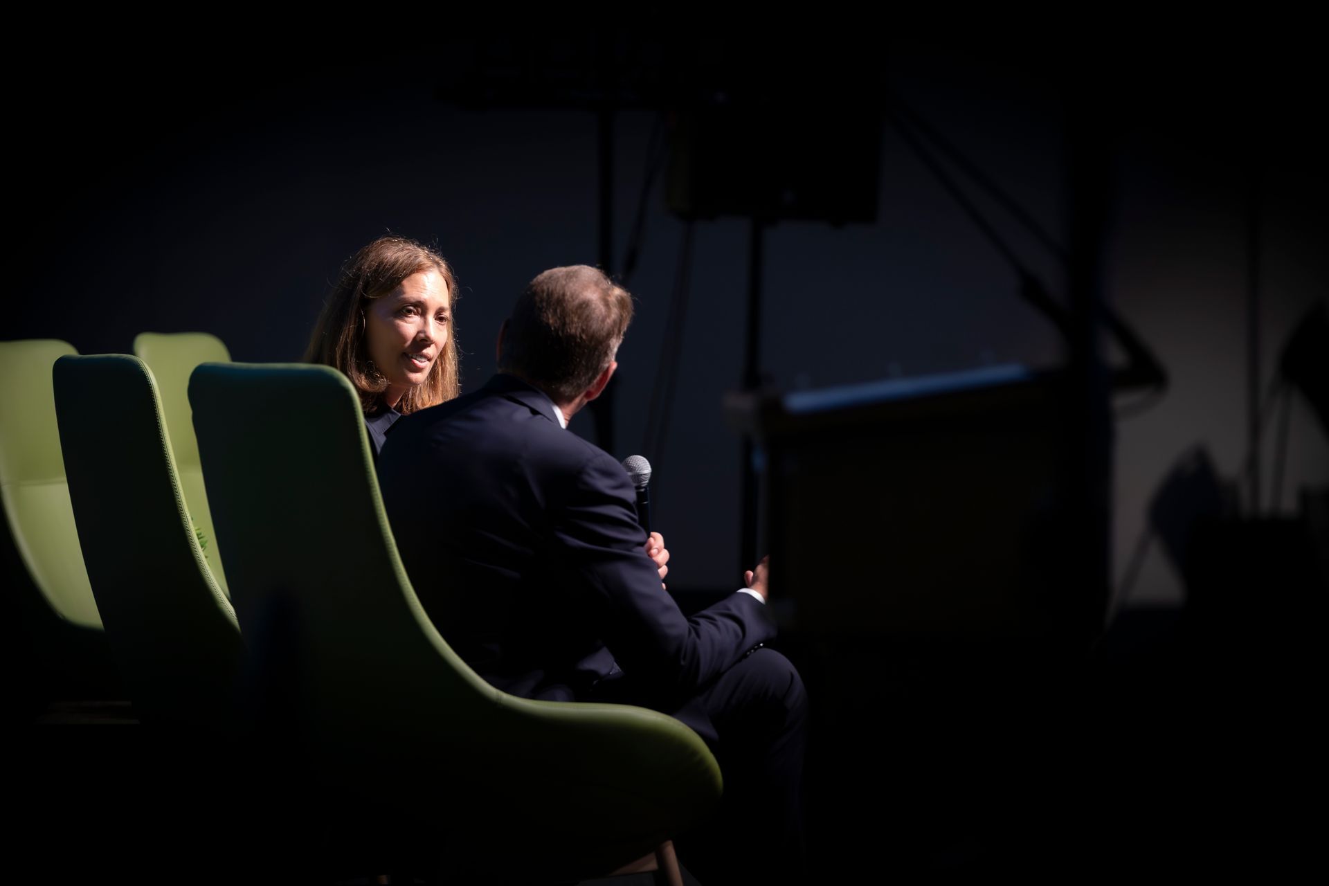 Scott Russell and Beckie Scott are talking on stage at Evening at Nipissing 2026