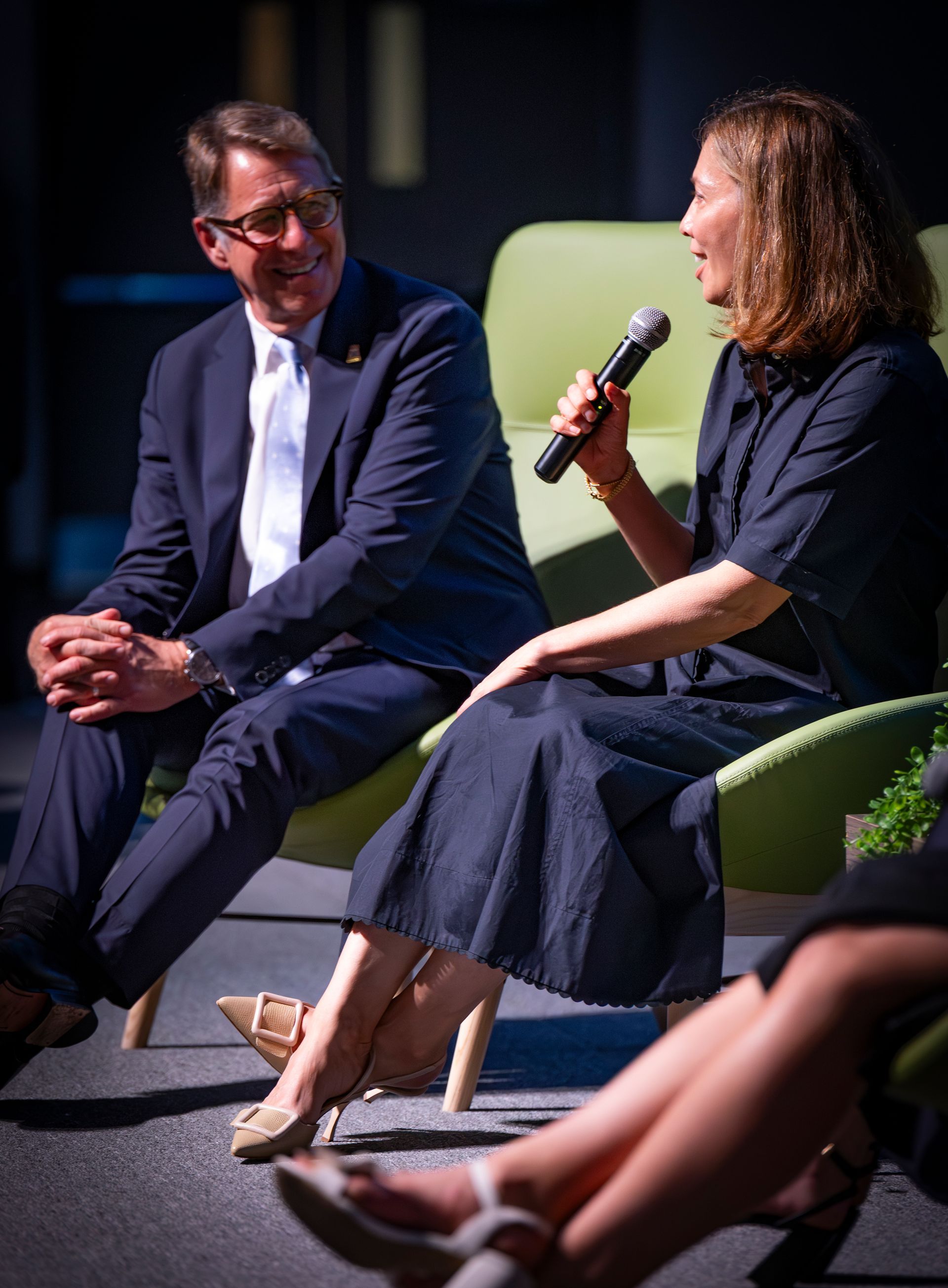 Scott Russell and Beckie Scott are talking on stage at Evening at Nipissing 2026