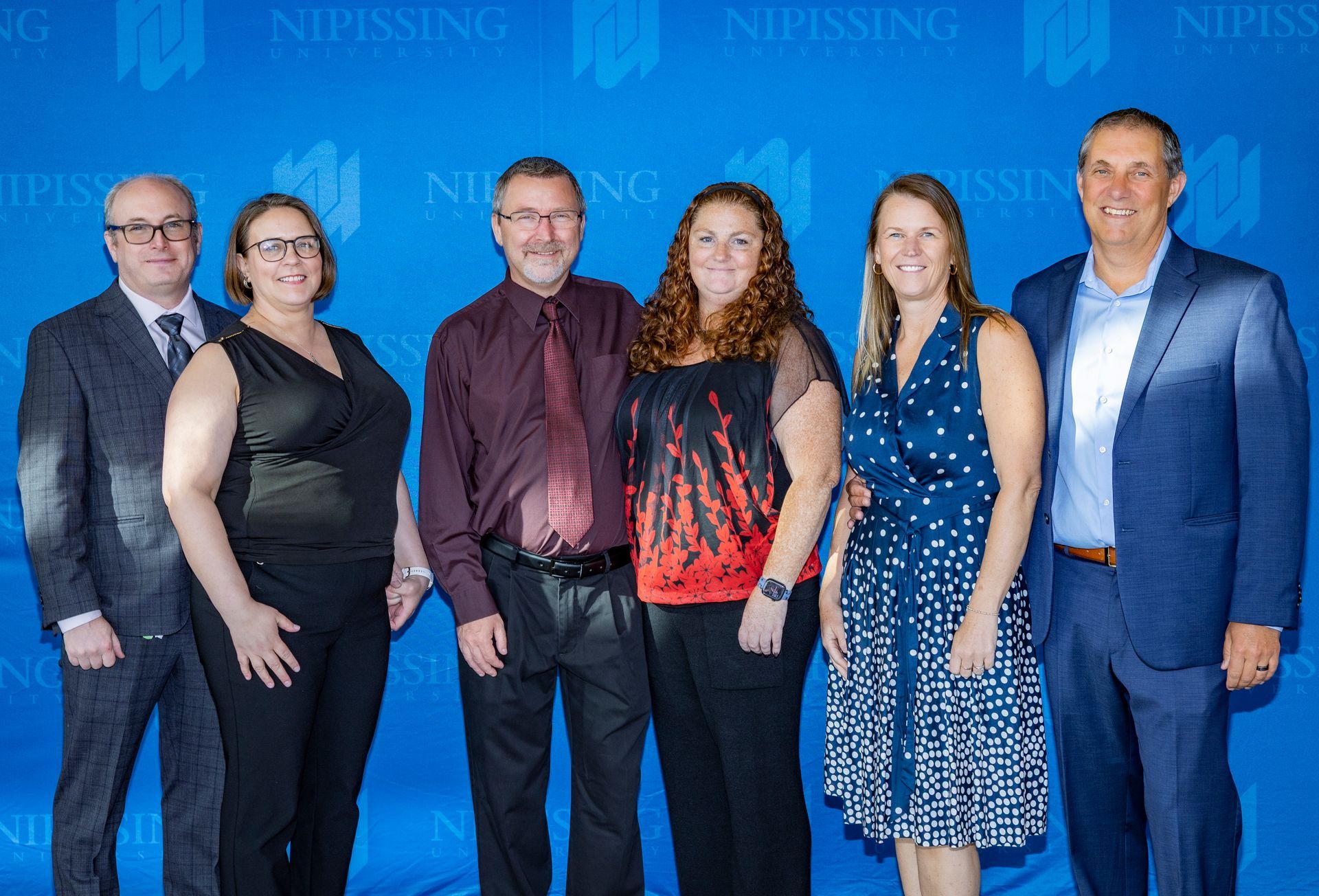 Evening at Nipissing 2026 attendees posing for a group photo. 